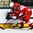 GRAND FORKS, NORTH DAKOTA - APRIL 22: Denmark's Jacob Schmidt-Svejstrup #8 and Latvia's Renars Krastenbergs #17 battle for the puck during relegation round action at the 2016 IIHF Ice Hockey U18 World Championship. (Photo by Matt Zambonin/HHOF-IIHF Images)

